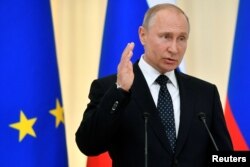FILE - Russian President Vladimir Putin speaks during a joint news conference with his Austrian counterpart following their talks in Sochi, Russia, May 15, 2019.