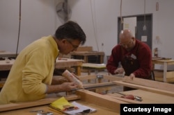 Mark Gatterdam (left) one of six partners, all craftsmen, who own and operate Hardwood Artisans, at work in the shop. (Photo by Erin Gallagher)