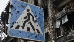 A road sign pierced by shrapnel stands at a new terminal of Donetsk Airport destroyed by shelling, in Donetsk, October 25, 2015. (Max Black/AP)