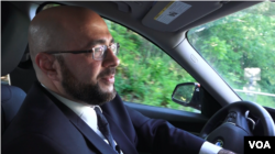 Mohamed Khairullah drives through his town, which is not much larger than one square kilometer. (Photo: R. Taylor / VOA)