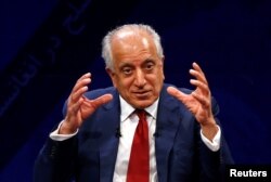 FILE - U.S. envoy for peace in Afghanistan Zalmay Khalilzad speaks during a debate at Tolo TV channel in Kabul, Afghanistan, April 28, 2019.