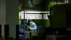 A man works at a manufacturing plant of Universal Electronics Inc. in Qinzhou in Guangxi Autonomous Region, China, April 12, 2021.