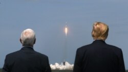 Donald Trump and U.S. Vice President Mike Pence watch the launch of a SpaceX.