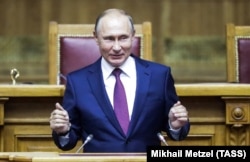 RUSSIA -- Russian President Vladimir Putin speaks during a session of the Eurasian Women's Forum in St. Petersburg, September 20, 2018