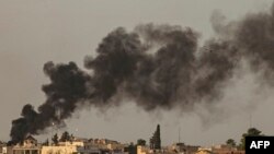 smoke billows following Turkish bombardment on Syria's northeastern town of Ras al-Ain in the Hasakeh province along the Turkish border on October 9, 2019. - Turkey launched an assault on Kurdish forces in northern Syria with air strikes and explosions re