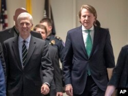 FILE - President Trump's White House counsel, Don McGahn, right, is seen on Capitol Hill in Washington, Feb. 6, 2017.