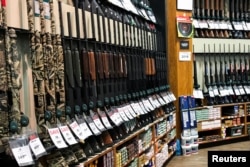FILE - Guns for sale are seen inside of Dick's Sporting Goods store in Stroudsburg, Pennsylvania, U.S., February 28, 2018. (REUTERS/Eduardo Munoz)