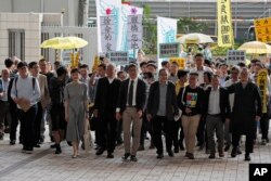 占中九子2019年4月9日在香港西九龙裁判法院前，(右起)邵家臻、李永达、黃浩铭、戴耀廷、陈健民、朱耀明、陈淑庄、锺耀华以及张秀贤