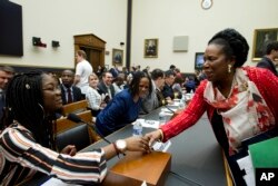 Rep. Sheila Jackson Lee D-Texas, shake hands with Marjory Stoneman Douglas High School senior Aalayah Eastmond, during a House Judiciary Committee hearing on gun violence, at Capitol Hill in Washington, Feb. 6, 2019.