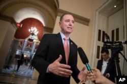 FILE - Rep. Adam Schiff, D-Calif., ranking member of the House Intelligence Committee, takes questions from reporters at the Capitol in Washington.