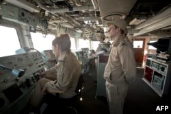 Romanian frigate "Regina Maria" personnel with the NATO Standing Maritime Group-2 work on the bridge during a military drill on the Black Sea, 60km from Constanta, Romania, March 16, 2015.
