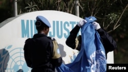 Manm Misyon Nasyon Zini pou Apiye Lajistis ann Ayiti, MINIJUSTH. Foto: REUTERS/Andres Martinez Casa