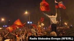 Macedonia - President of pro-Russian party, United Macedonia, Janko Bachev, waves the Macedonian and Russian flags as police desperse demonstrators against the Macedonia name change in front of the Parliament in Skpoje, June 17, 2018