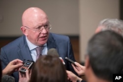 FILE - Russia's U.N. Ambassador Vassily Nebenzia speaks to reporters after attending a Security Council meeting, Aug. 9, 2017, at United Nations headquarters.