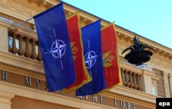 Montenegro -- Flags of NATO and Montenegro fly on the Goverment House building, in Cetinje, December 3, 2015