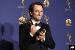 Matthew Rhys poses in the press room with the award for outstanding lead actor in a drama series for "The Americans" at the 70th Primetime Emmy Awards, Sept. 17, 2018, at the Microsoft Theater in Los Angeles.