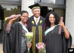 Bongiwe Tyhala (left) and Pumza Ghu (right), who failed high school mathematics and science, receive their medical degrees and are congratulated by Stellenbosch University dean Prof.Russel Botman