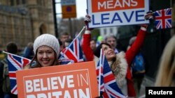 Pro-Brexit protesters demonstrate outside the Houses of Parliament, ahead of a vote on Prime Minister Theresa May's Brexit deal, in London, Britain, Jan. 15, 2019.