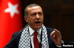 FILE - Turkey's Prime Minister Tayyip Erdogan addresses members of parliament from his ruling AK Party (AKP) during a meeting at the Turkish parliament in Ankara, July 22, 2014.