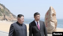 朝鲜领导人金正恩与美国总统特朗普2018年6月举行峰会前先到中国大连会晤习近平