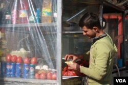 At a cafe in The Apartments, a densely populated urban complex, locals say fighting in their area was fierce and soldiers had to operate on foot because the roads are too narrow for Humvees to navigate, in Mosul, Iraq, Feb. 8, 2017 in Mosul, Iraq. (H. Murdock/VOA)