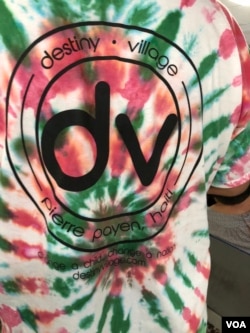 Pastor Martin Guerrena’s tie-dyed T-shirt made by orphans at Destiny Village. (S. Lemaire/VOA)