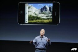 Apple Phil Schiller talks about the camera on the iPhone 4S during an announcement at Apple headquarters in Cupertino, Calif., Tuesday, Oct. 4, 2011. (AP Photo/Paul Sakuma)