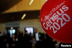 FILE - Balloons decorate an event for community activists and local government leaders to mark the one-year-out launch of the 2020 Census efforts in Boston, April 1, 2019.