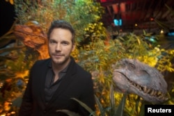 FILE - Actor Chris Pratt, who plays raptor trainer Owen in "Jurassic World", poses at Universal Studios in Los Angeles, California, June 6, 2015.