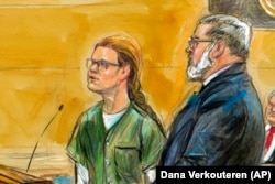 U.S. -- In this courtroom sketch, Maria Butina, left, is shown next to her attorney Robert Driscoll, before U.S. District Judge Tanya Chutkan, during a court hearing at the U.S. District Court in Washington, December 13, 2018.