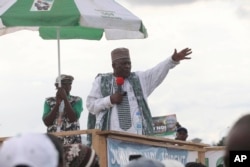 FILE - Ni John Fru Ndi Social Democratic Front, presidential candidate, speaks to his supporters during an election campaign in Yaounde, Cameroon, Oct. 8. 2011.