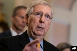 FILE - Senate Majority Leader Mitch McConnell, R-Ky., speaks to reporters at the Capitol in Washington, April 9, 2019.