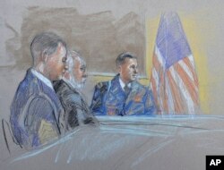 FILE - Capt. John Billings, right, is questioned as Sgt. Bowe Bergdahl, left, and lead defense counsel, Eugene Fidell, look on during a preliminary hearing to determine if Bergdahl should face a court-martial, at Fort Sam Houston in San Antonio, Texas, Sept. 17, 2014.