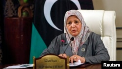 Libyan Tourism Minister Ikram Abdusalam Bash Imam speaks during a news conference in Tripoli, July 16, 2013.