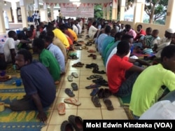 Christians breaking the fast wtih Muslims at a mosque in Yaounde.