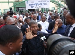 Angola's MPLA main ruling party candidate and defence minister, Joao Lourenco, shows his ink-stained finger after casting his vote in elections in Luanda, Aug. 23, 2017.