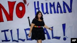 Astrid Silva walks to the stage to speak about immigration