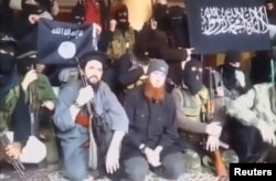 Syria - A still image taken on July 14, 2016 from an undated video posted on social media, shows Islamic State senior operative Abu Omar al-Shishani (C) sitting with fighters in an unknown location