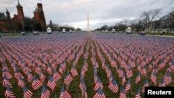 Thousands of U.S. flags are seen at the National Mall, as part of a memorial paying tribute to the U.S. citizens who have died from the COVID-19, near the Capitol ahead of President-elect Joe Biden's inauguration, in Washington, D.C.