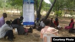 A community discusses some local problems at an outreach program conducted by the Rural Communities Development Trust. (Photo: RCDT)