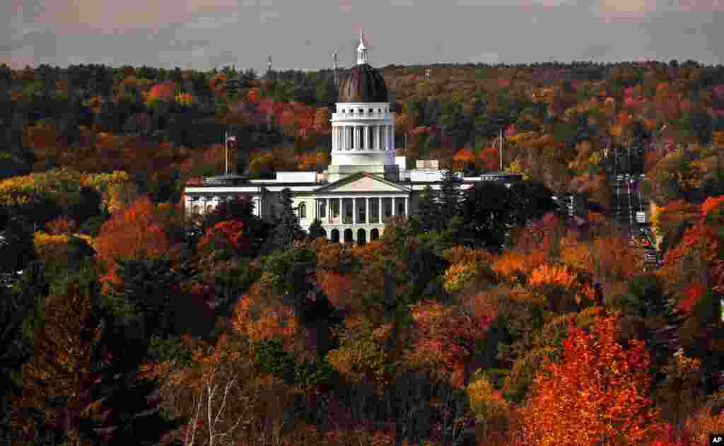 The State House is surrounded by fall foliage in Augusta, Maine, Oct. 23, 2017.