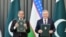President of Uzbekistan Shavkat Mirziyoyev, right, and Pakistani Prime Minister Shehbaz Sharif exchange the joint declaration in Tashkent, Uzbekistan, on Feb. 26, 2025. (Courtesy Sharif office)