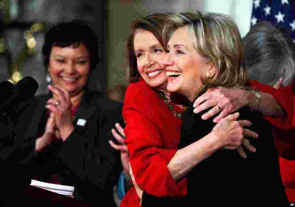 House Speaker Nancy Pelosi with Clinton in Statuary Hall on Capitol Hill in Washington, March 25, 2010, during the Women's History Month celebration. EPA Administrator Lisa Jackson applauds at left. 