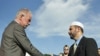 Dove World Outreach Center pastor Terry Jones (l) shakes hands with Imam Muhammad Musri, president of the Islamic Society of Central Florida in Orlando, 09 Sep 2010