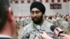 FILE - U.S. Army Capt. Tejdeep Singh Rattan speaks to journalists at Fort Sam Houston in San Antonio, March 22, 2010. Rattan was the first Sikh allowed to complete officer basic training while wearing the traditional turban and full beard since the Army altered its dress code. The New York City police have now adopted a similar dress policy.