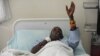 An injured Kenyan policeman lies on a hospital bed in Nairobi on November 11, 2012 recounting how he an others were attacked in Baragoi, Samburu North District yesterday. 