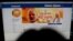 FILE - A woman checks the Facebook page of India's ruling Bharatiya Janata Party, in New Delhi, March 26, 2019.