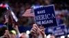 Delegates wave signs and flags during the final day of the Republican National Convention in Cleveland, July 21, 2016. 
