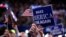 Delegates wave signs and flags during the final day of the Republican National Convention in Cleveland, July 21, 2016. 