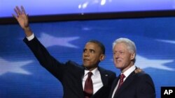 President Barack Obama waves as he joins Former President Bill Clinton during Democratic National Convention Sept. 5, 2012